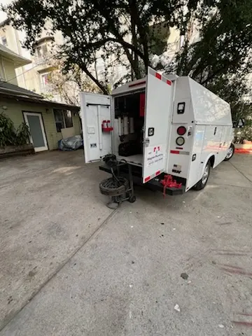 Magnet Plumbing service vehicle on-site for Grease Trap Cleaning in River Club Estates